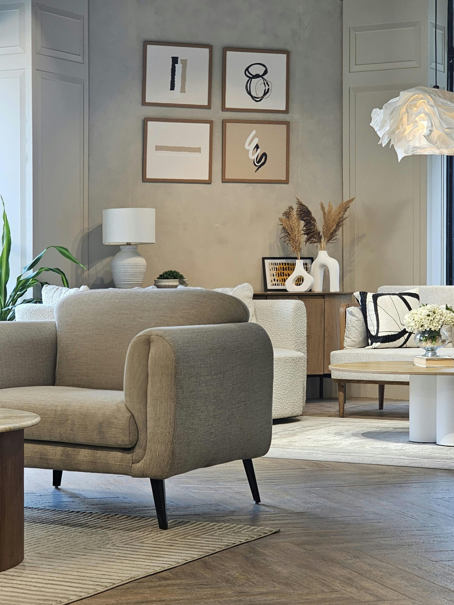 Serviced Apartments vs Hotels in Delhi NCR: Which Is Better for Your Stay? Elegant modern living room featuring stylish furniture and minimalist decor design.